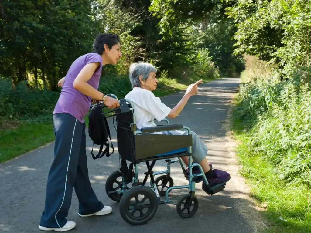 Home care in Newham Jothno Care and Support - carer and elder in wheelchair